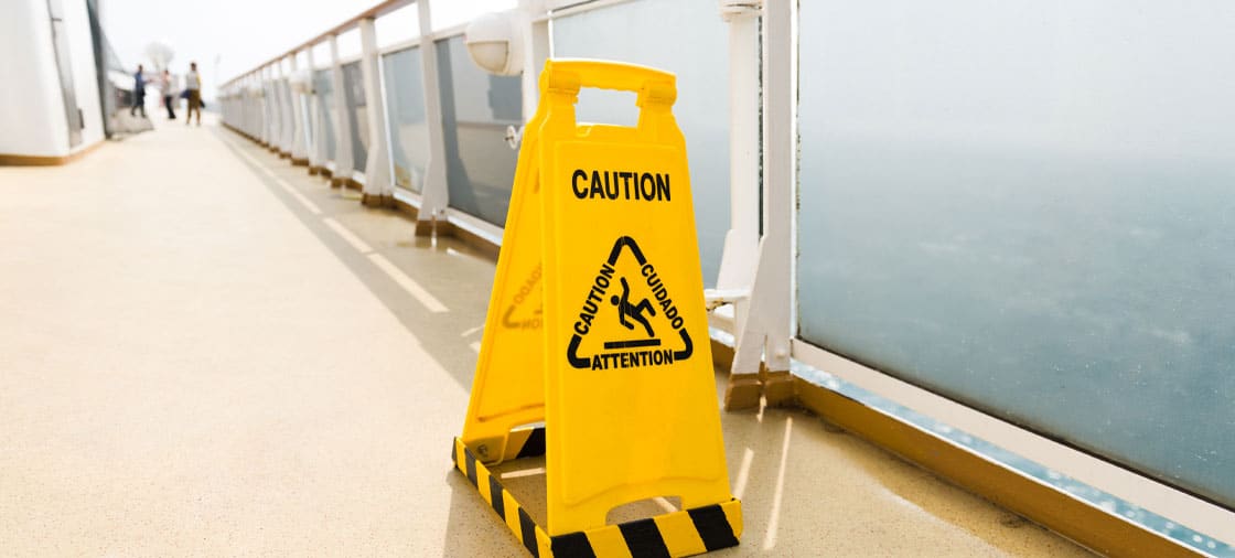 caution wet floor sign found on the deck of a cruise ship