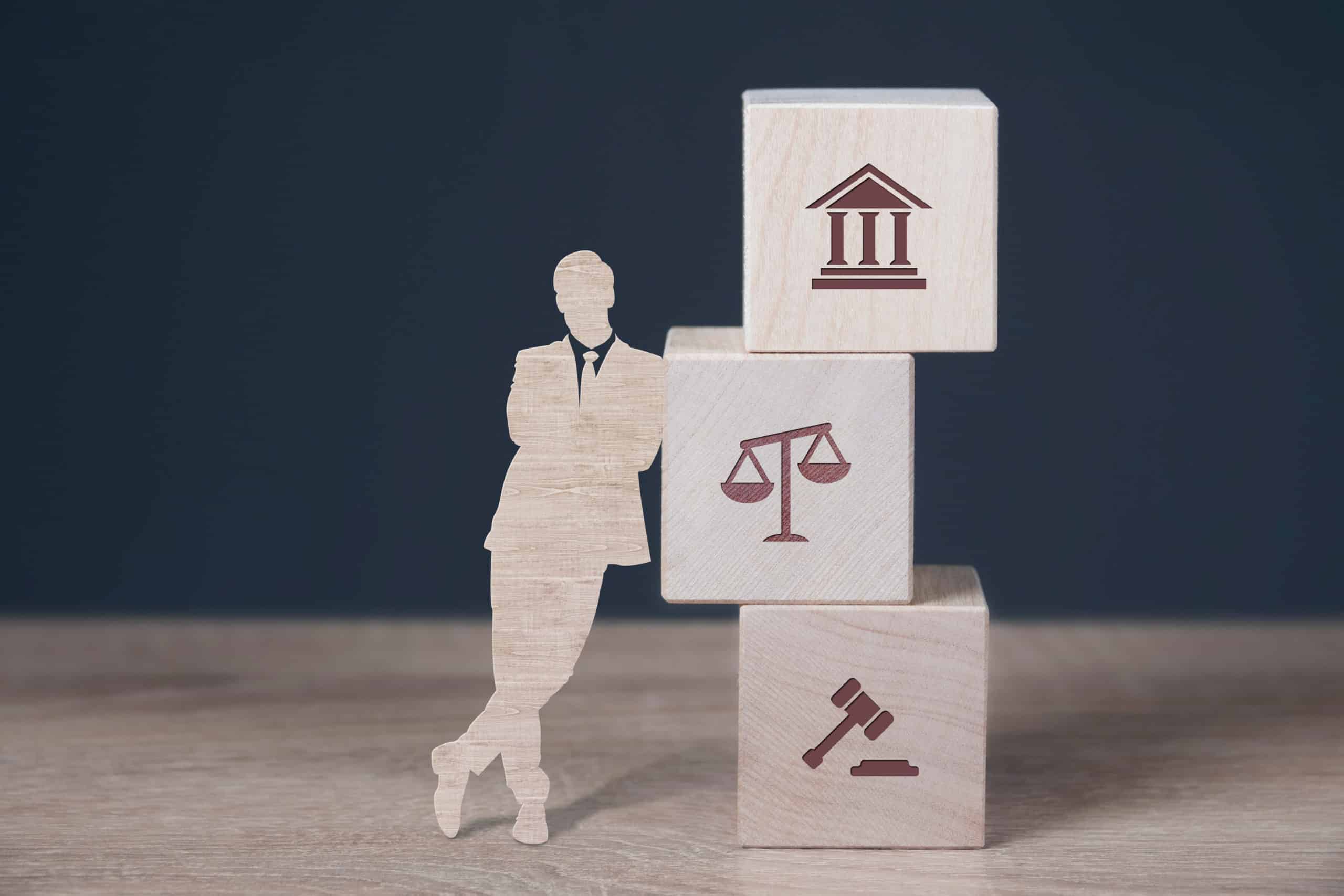 Employment lawyer made of wooden bocks.