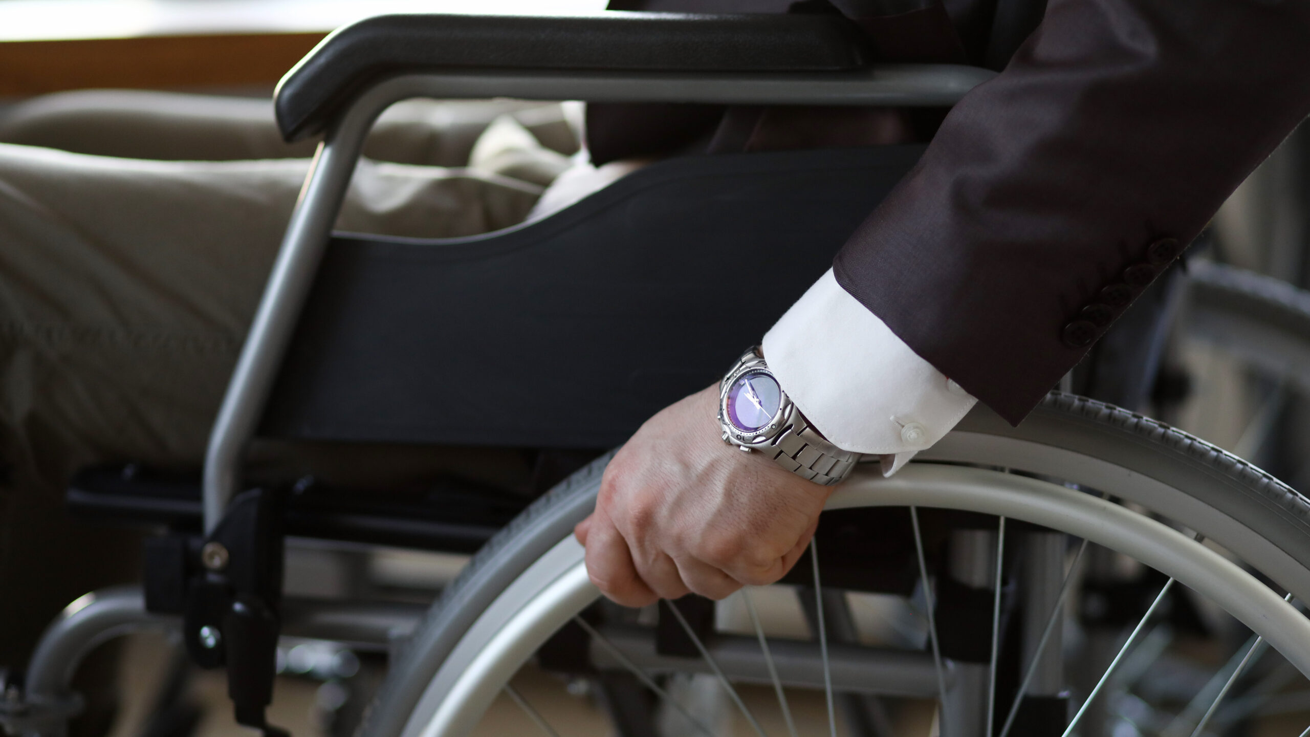 White collar business man facing disability discrimination in workplace.