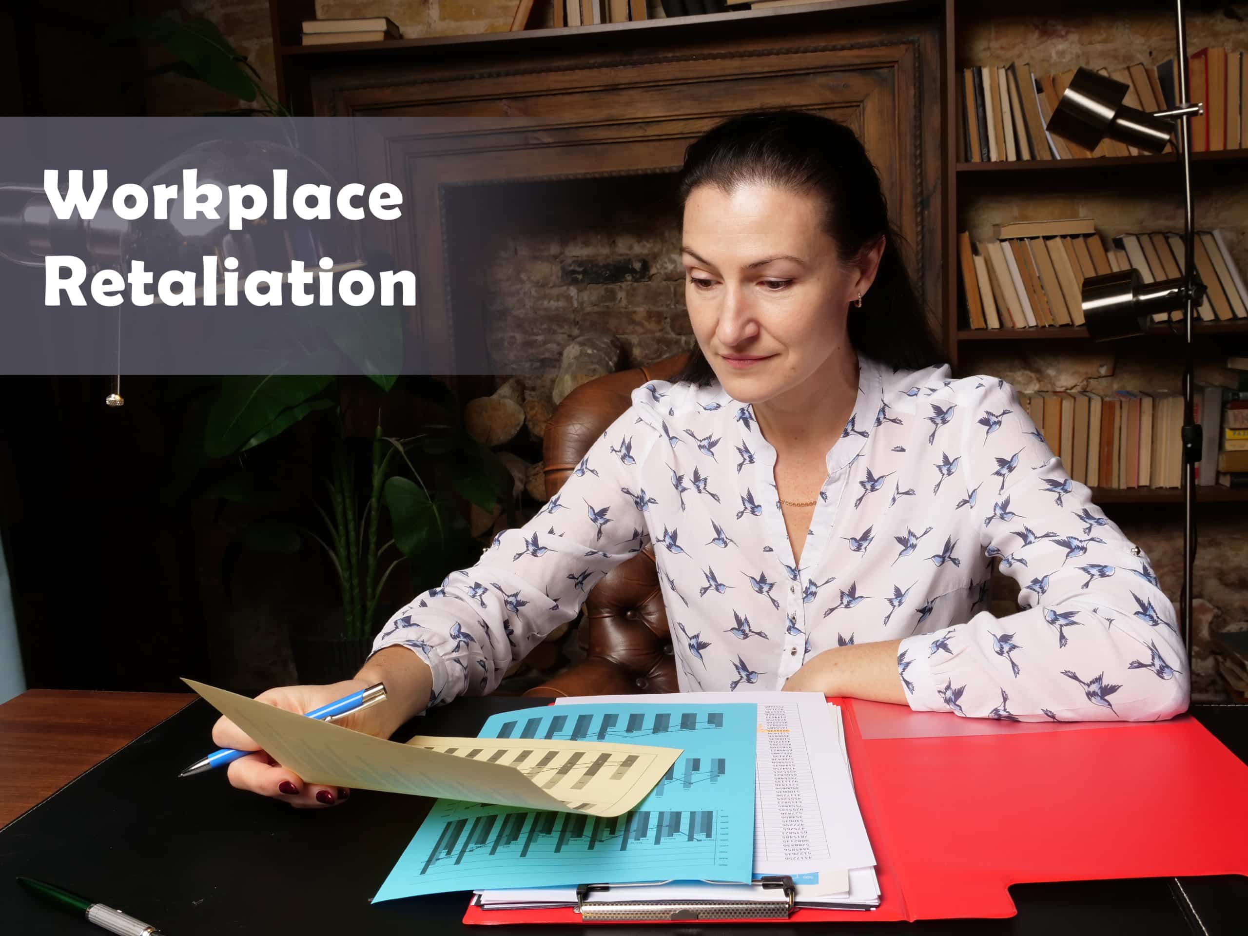 A woman looks at retaliation forms from her employer.