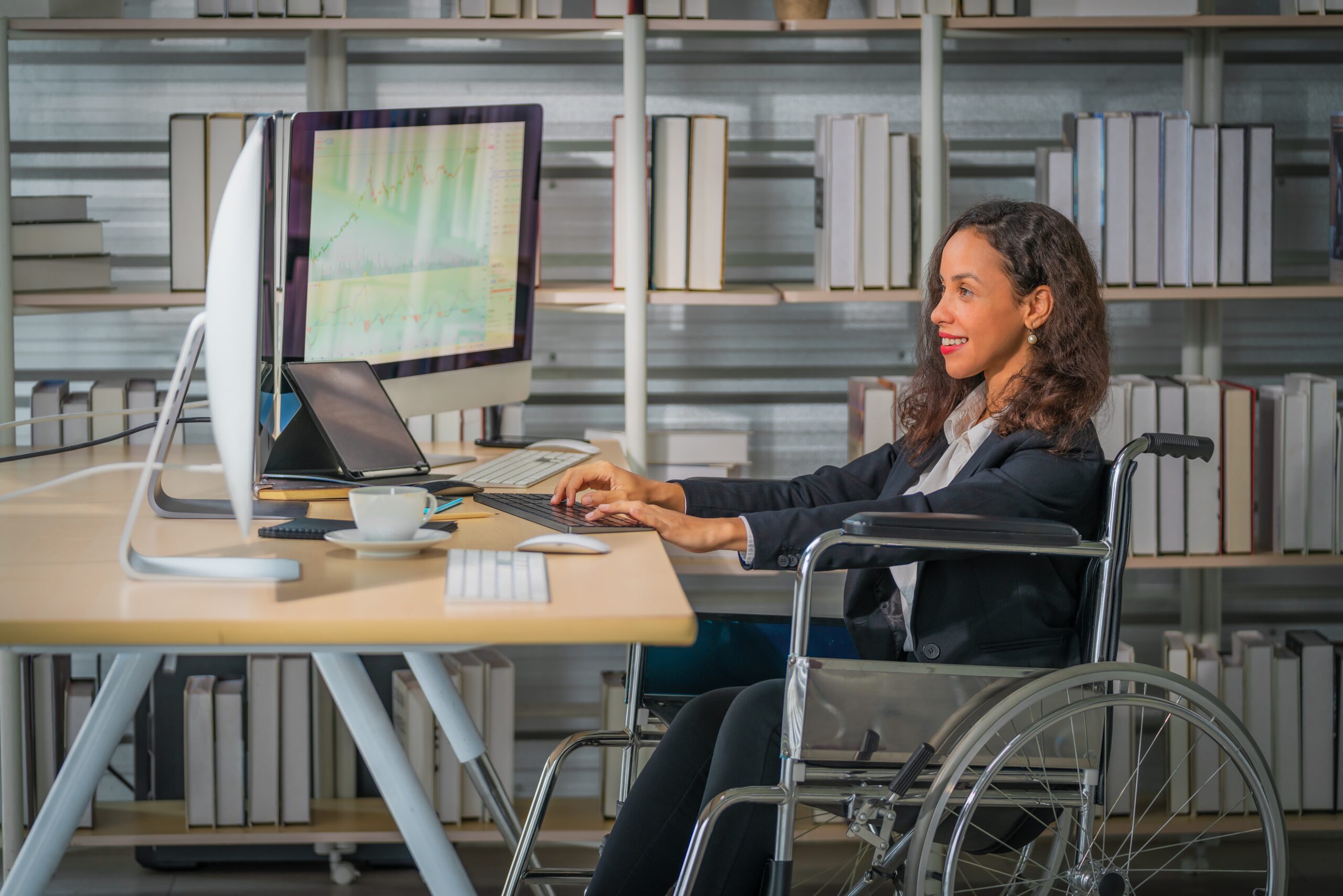 A business professional works in a wheelchair.