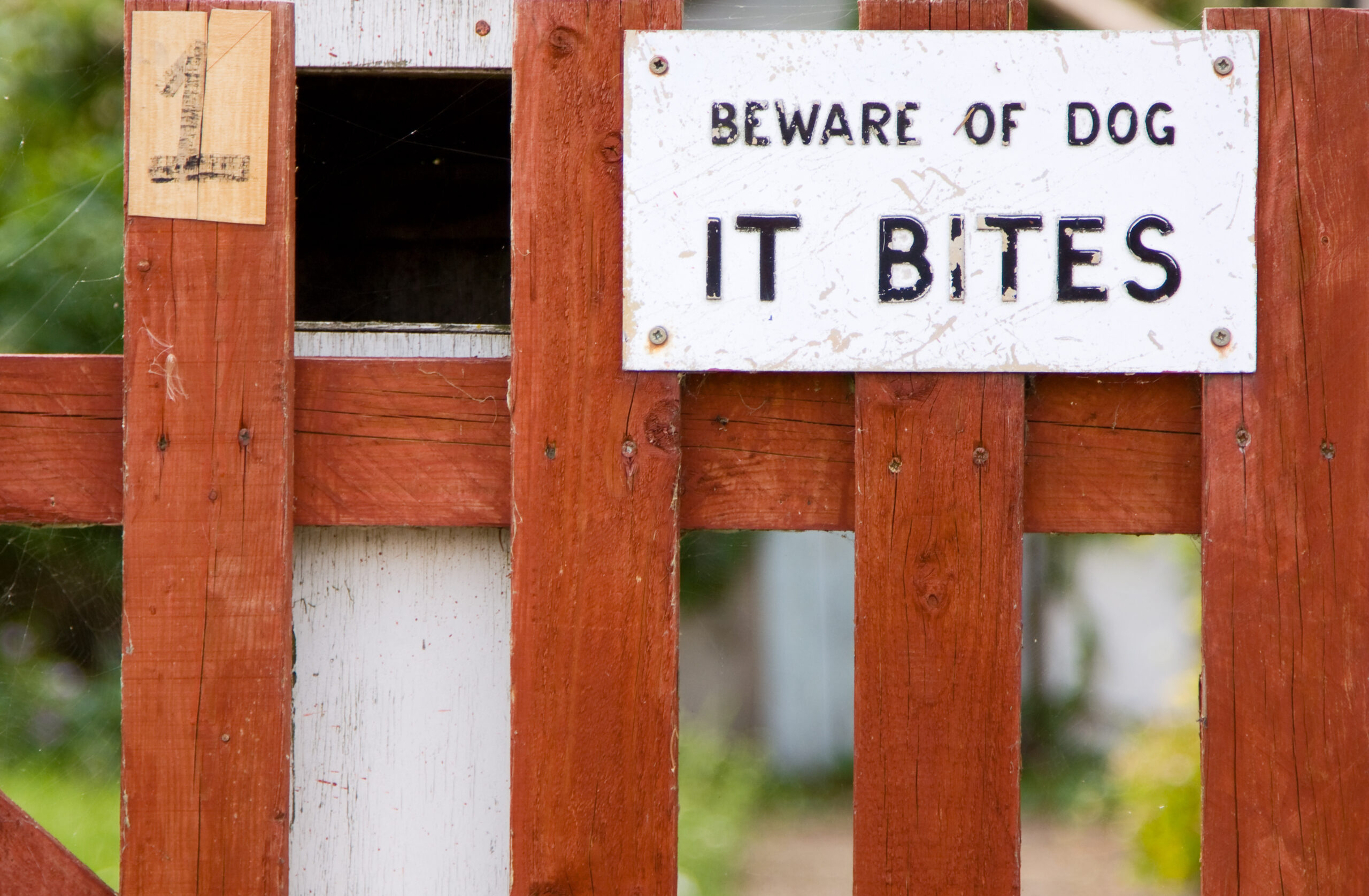A "beware of dog" sign outside of a house.