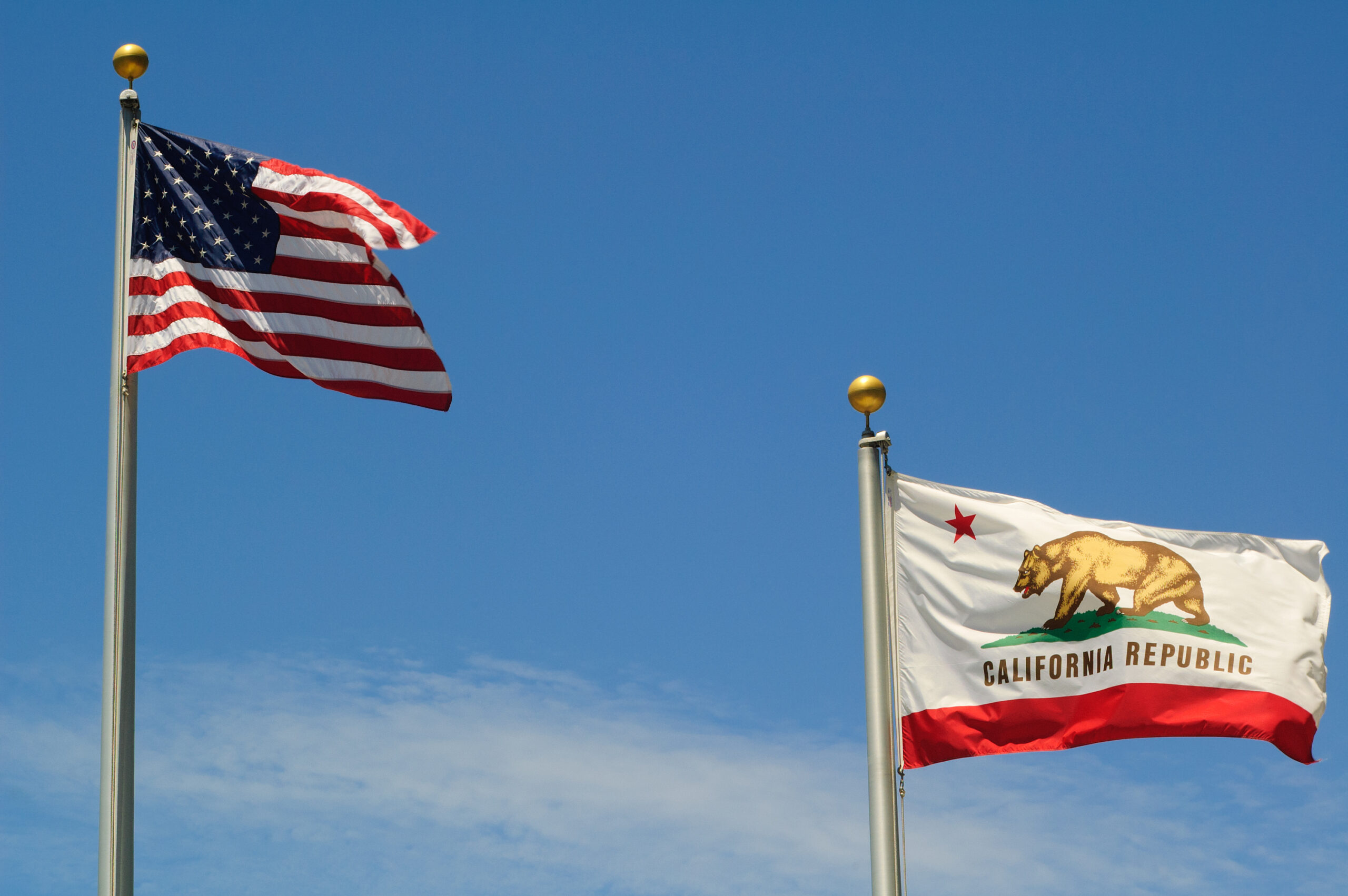 California government and U.S. flags.