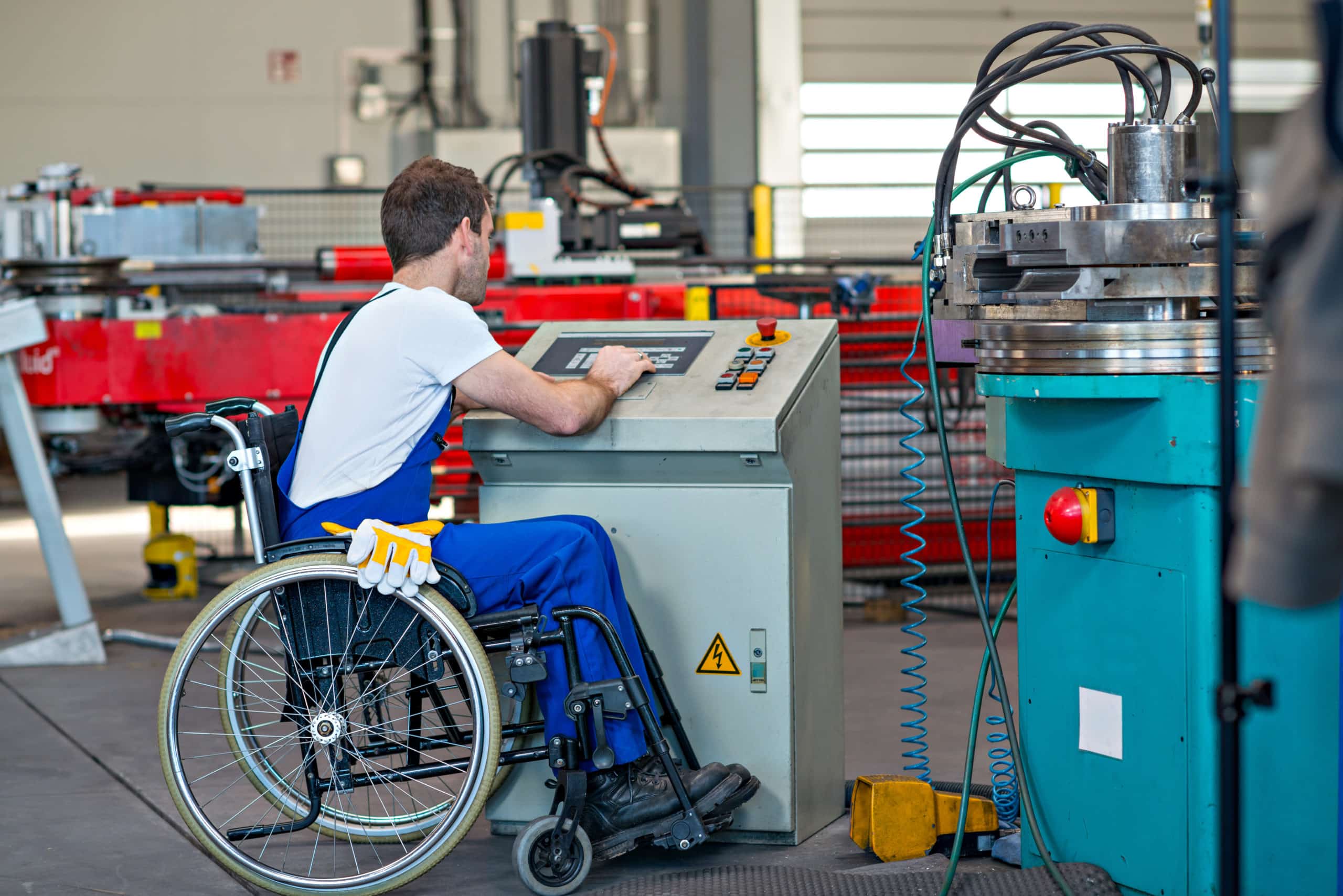 A worker in a wheelchair completes their duties.