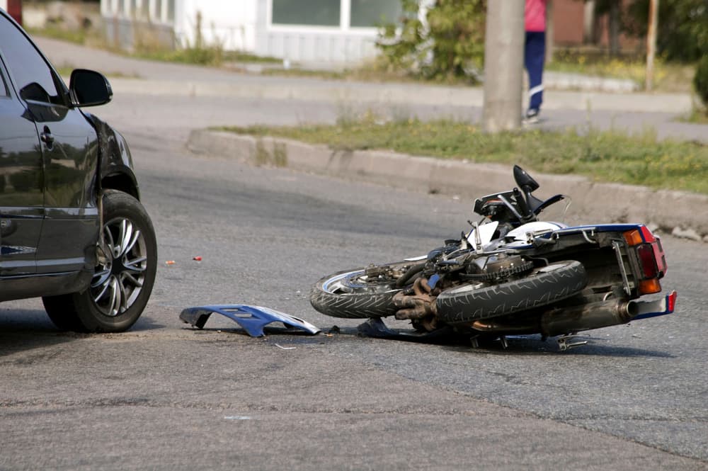 A crash motorcycle lies on the road in San Francisco.