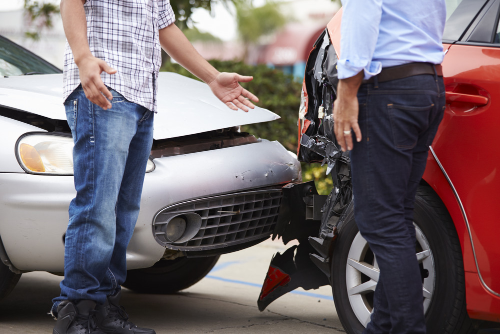 Insurance adjuster negotiating with the car accident victim after the accident